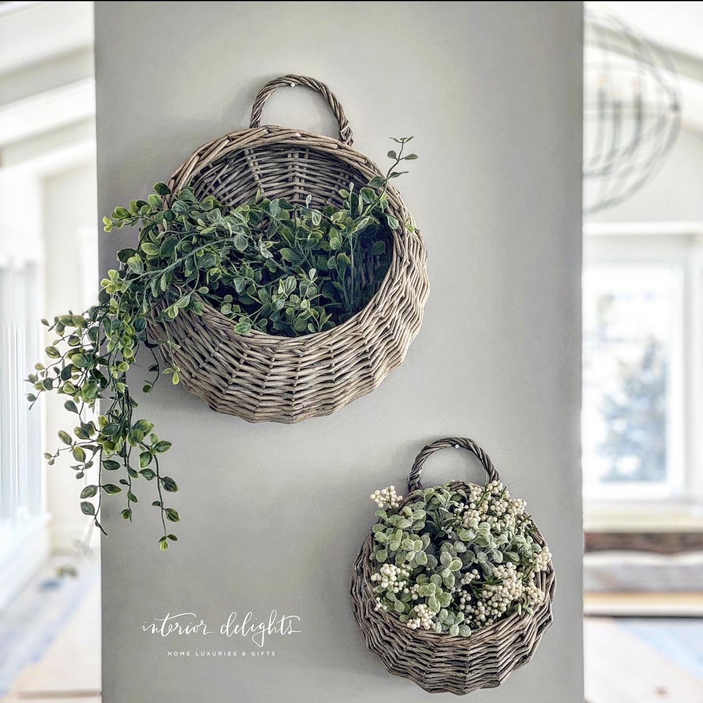 Small Round Willow Basket from the Set of 2, ideal for wall decor with greenery or flowers.