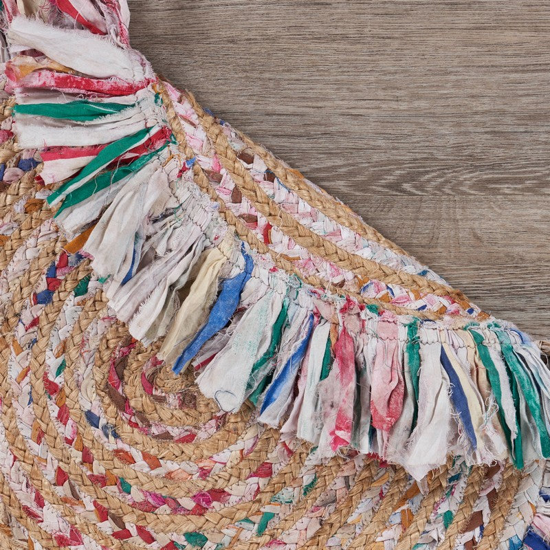 Hand-woven Allison Pastel Rug made of cotton and jute, highlighting its round shape and soft texture.