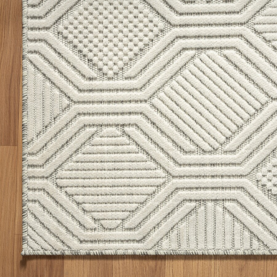 The Jennifer Rug in Siler/Gray displayed in an outdoor setting, perfect for patio decor.