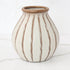7 inch beige stripe ceramic vase with textured cream glaze and light brown linear detailing.