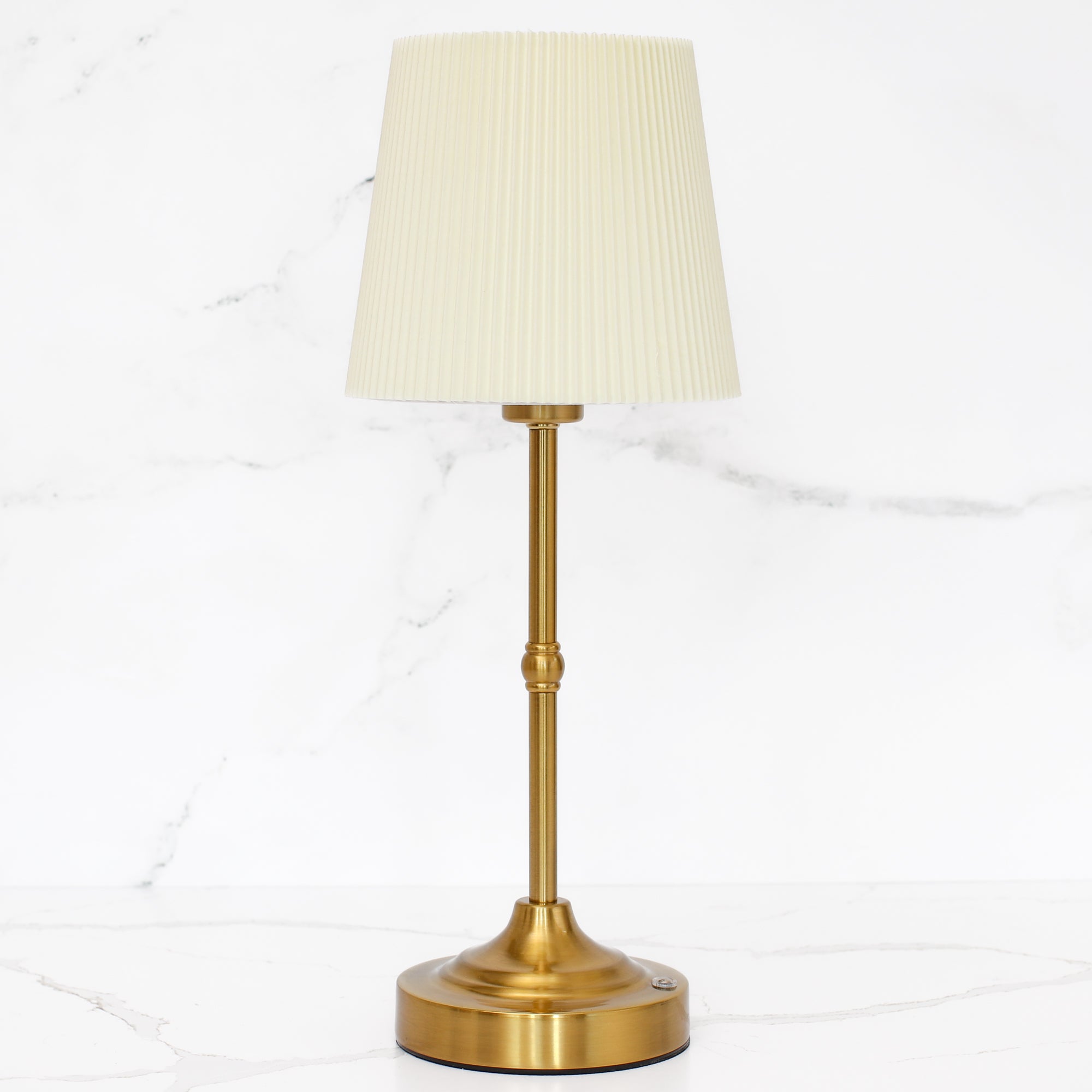 Rechargeable Gold LED Tap Lamp providing cozy lighting in a dining area.