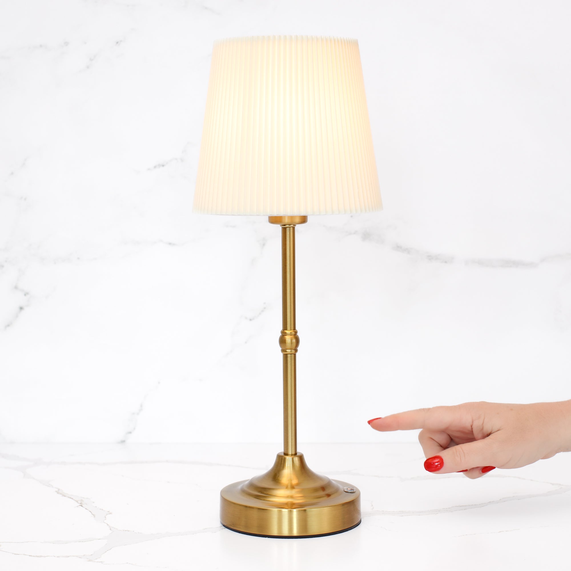 Rechargeable Gold LED Tap Lamp turned on, highlighting its stylish design and glow.