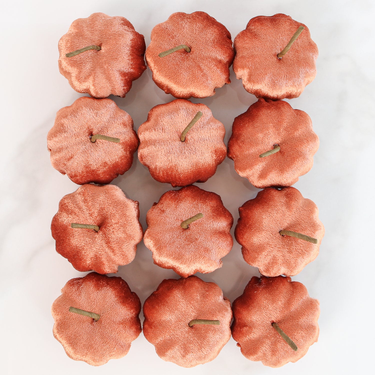 Close-up of Red Rocks Velvet Mini Pumpkins - Set of 12, showcasing the cozy texture and warm color ideal for festive displays.