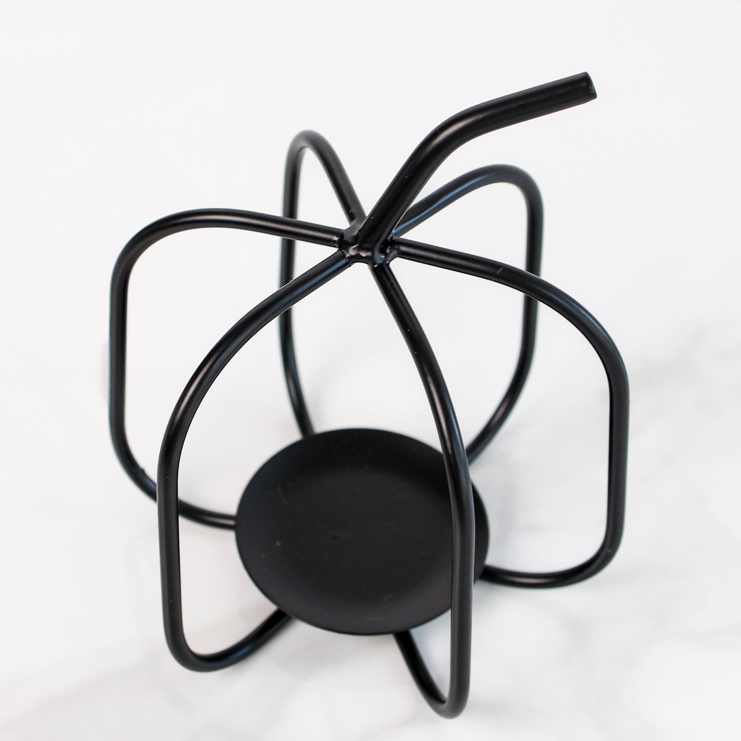 Close-up of the Black Metal Pumpkin candle holder, highlighting the durable wrought iron craftsmanship and festive fall character.