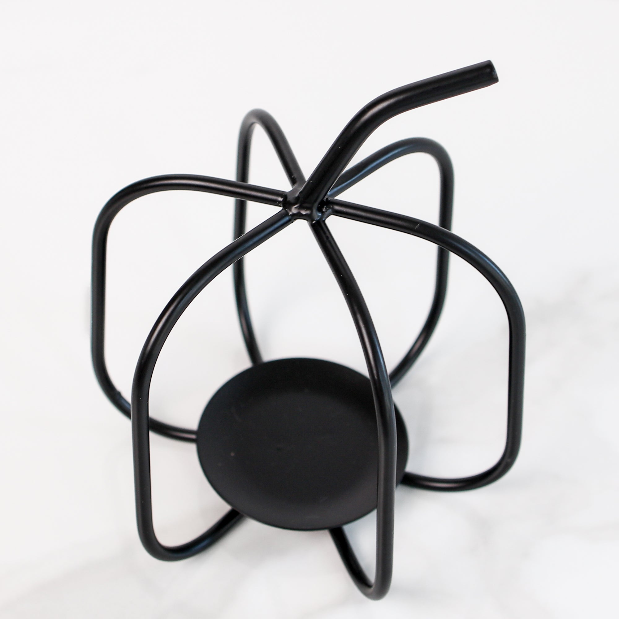 Close-up of the Black Metal Pumpkin candle holder, highlighting the durable wrought iron craftsmanship and festive fall character.