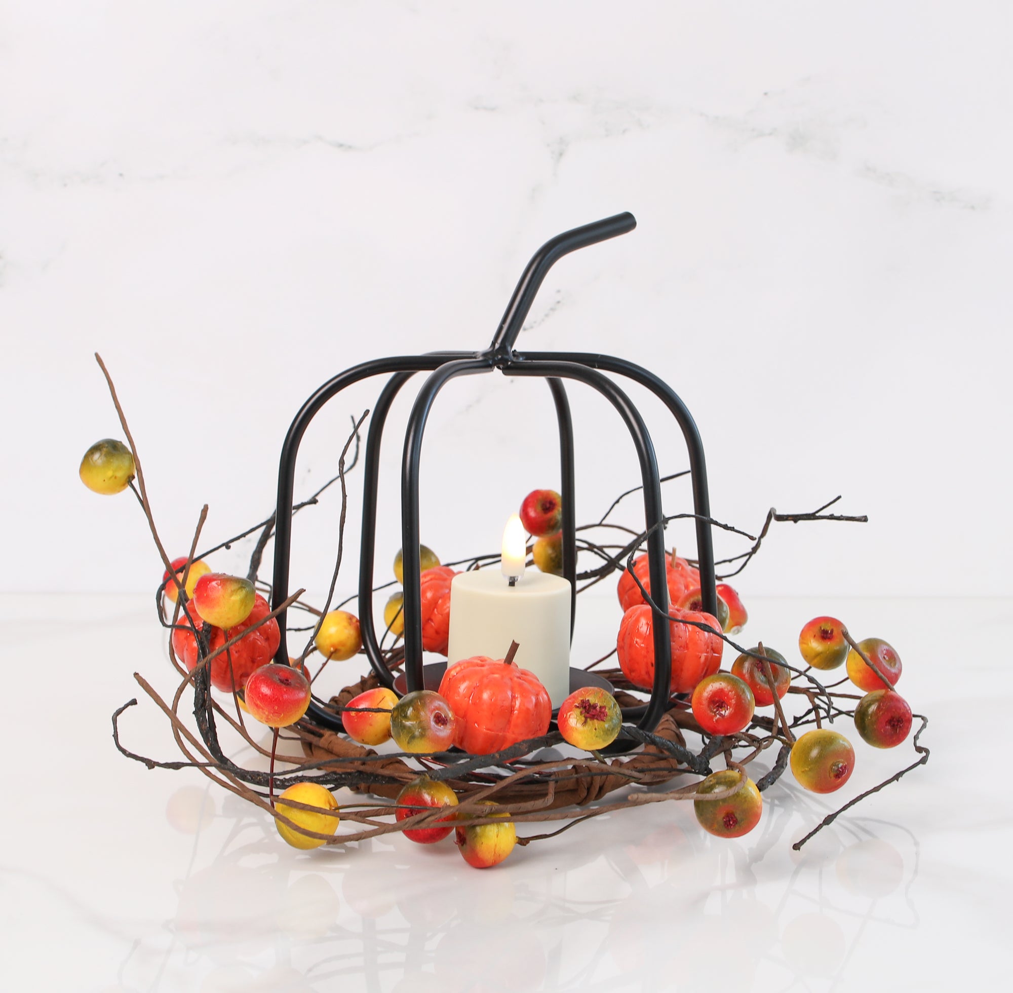 Black Metal Pumpkin candle holder handcrafted in the USA, showcasing its rustic charm and pumpkin silhouette design for autumn decor.