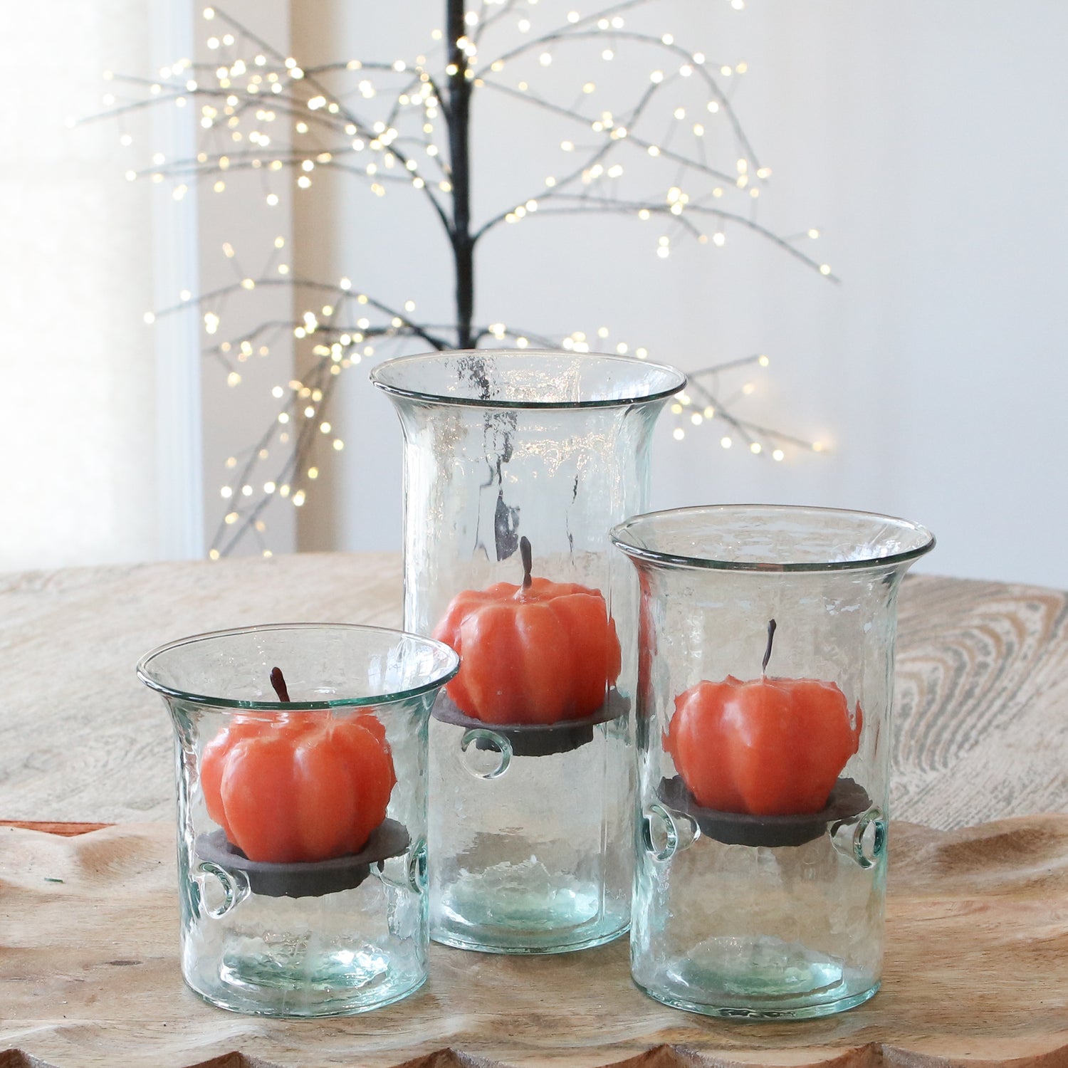 Close-up of Scented Orange Pumpkin Votive showcasing its vibrant orange color and festive pumpkin design.
