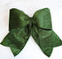 Large Green Outdoor Velvet Bow displayed on a door for a festive look.