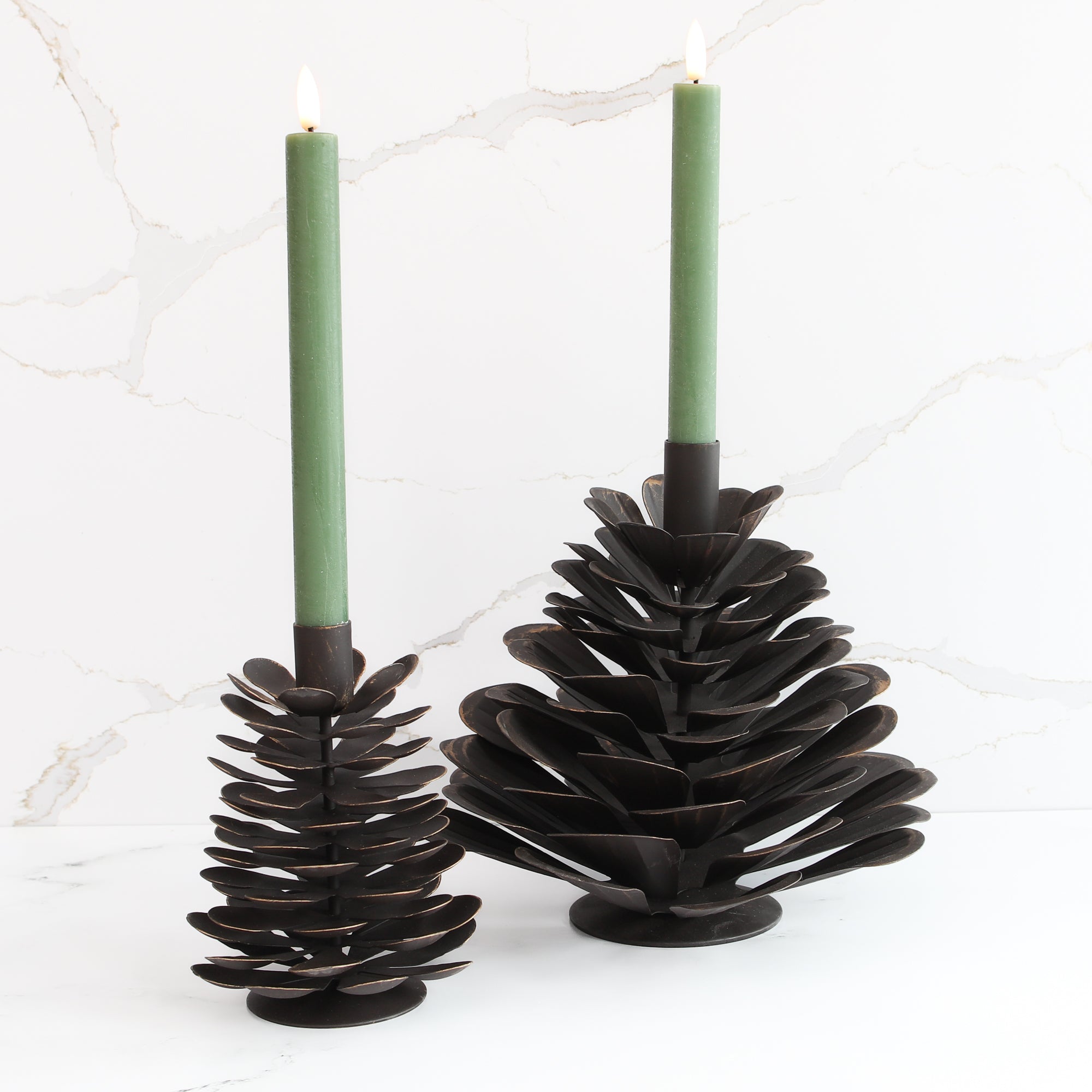 10" LED Taper, Set of 2 Green candles displayed elegantly on a mantel, perfect for seasonal decor.