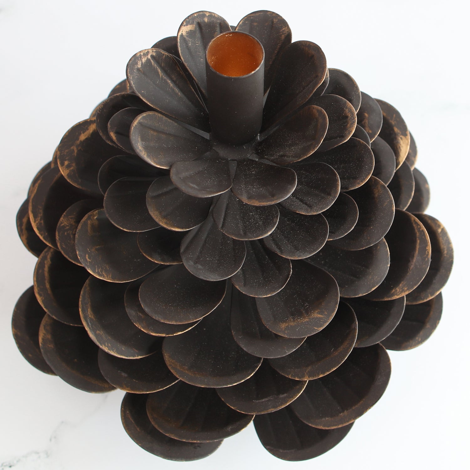 Large Iron Pinecone Candle Holder with a bronzed edge, perfect for festive table settings.