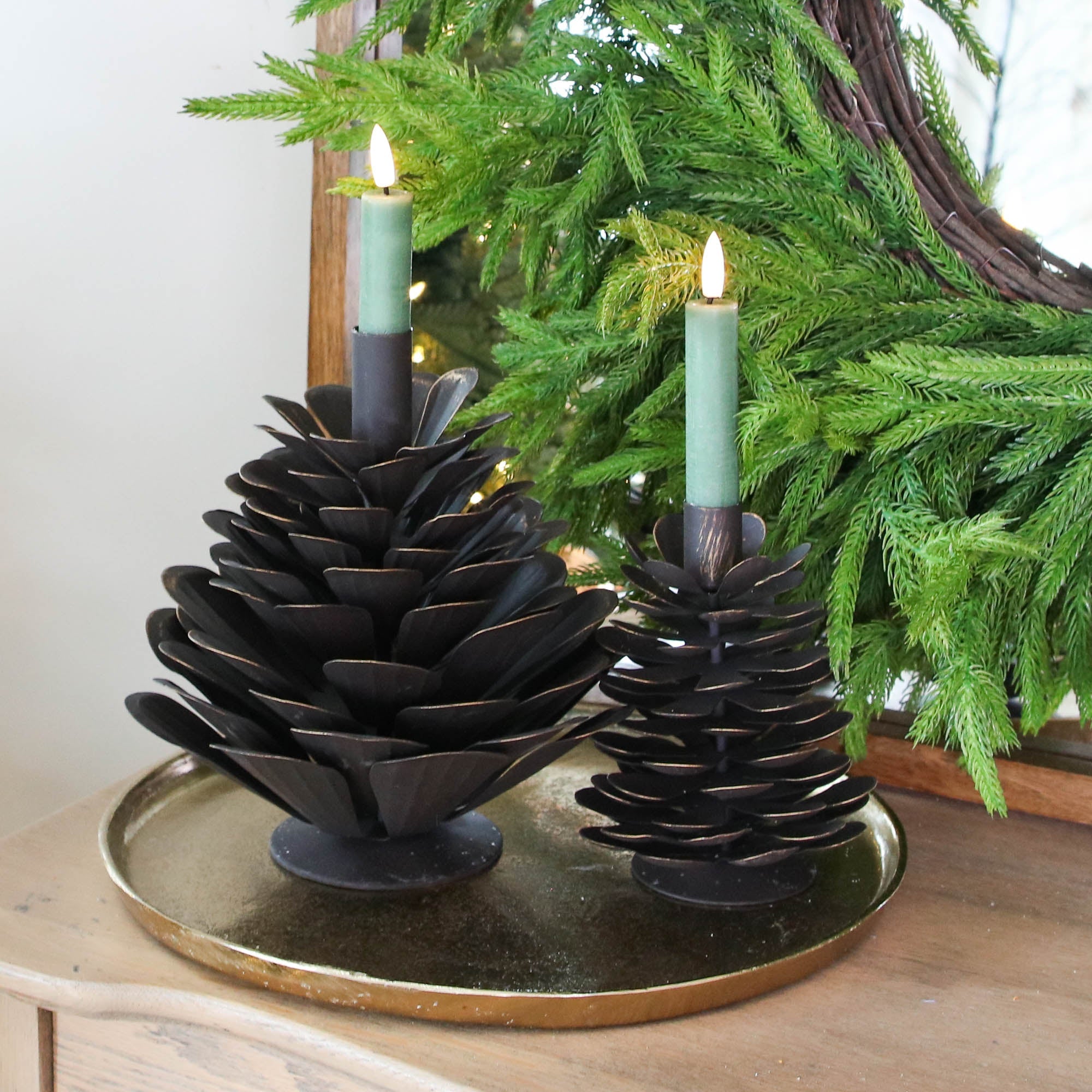 ARRANGEMENT: Sled Risers with Pinecones and Glitter Wreaths
