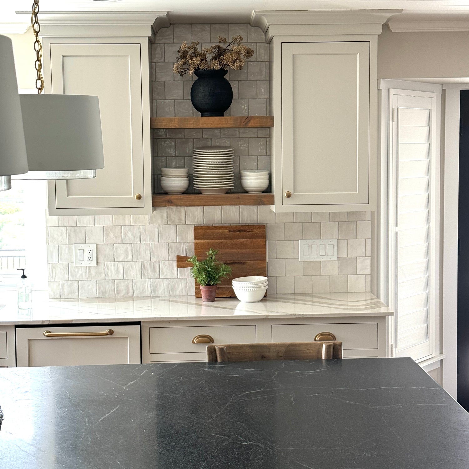Stylish 9.5" Black Paul Vase in a modern living space, adding a touch of luxury to any interior.