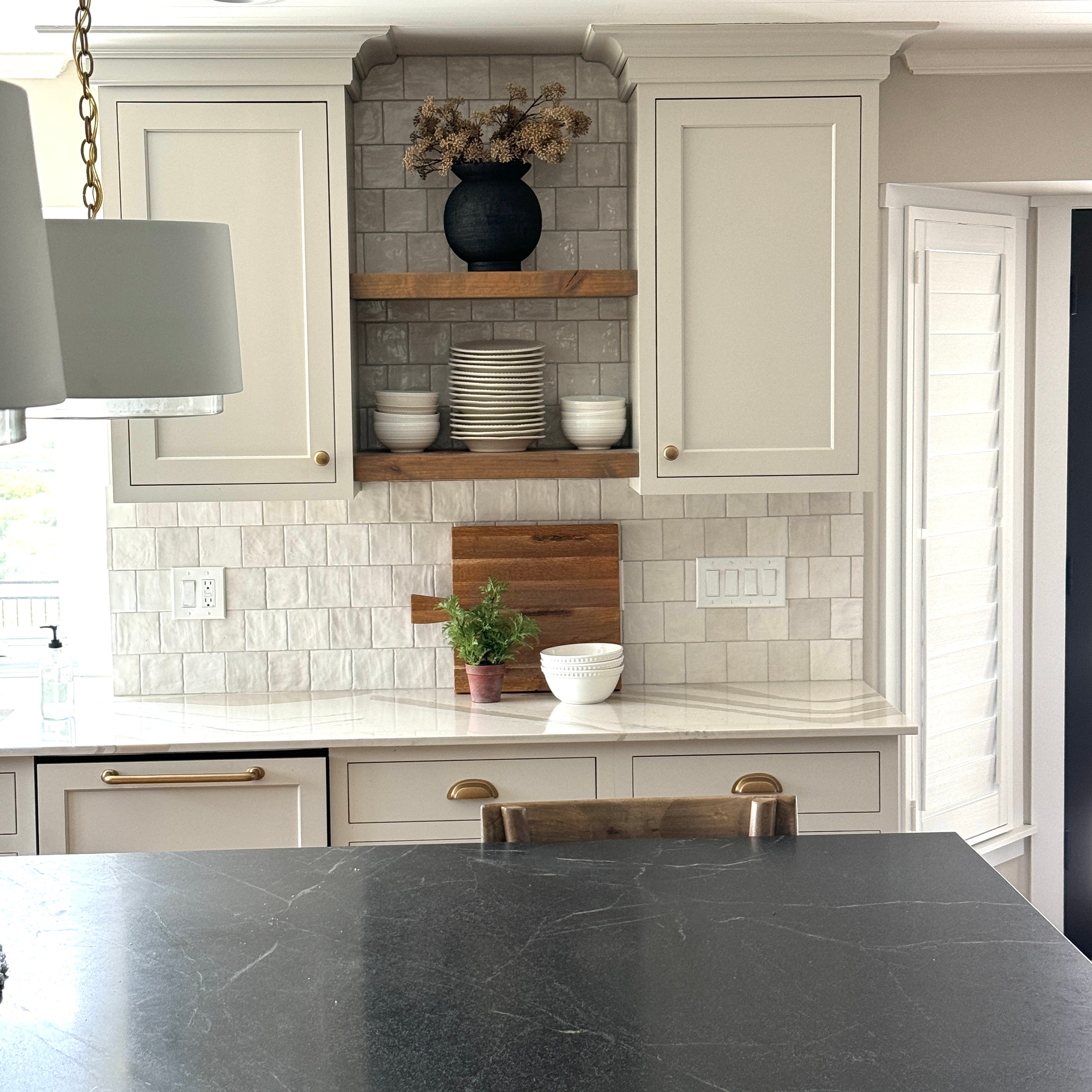 Stylish 9.5" Black Paul Vase in a modern living space, adding a touch of luxury to any interior.
