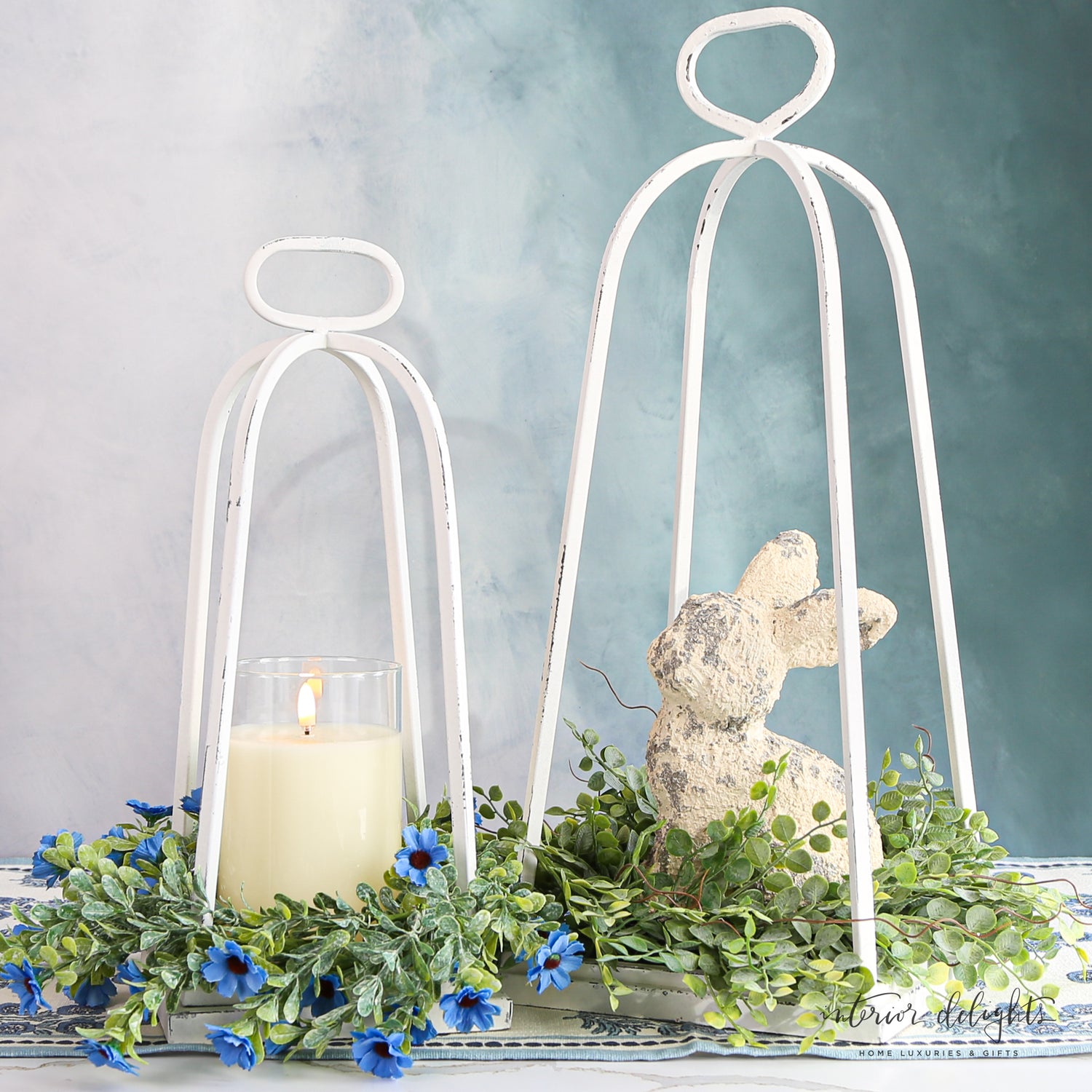 White Distressed Lanterns - Set of 2 showcasing their vintage-inspired design and weathered metal finish.