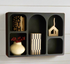 Black Textured Shelf displayed with stylish decor in a modern living room, showcasing its arched cubbies and versatile design ideal for any wall.
