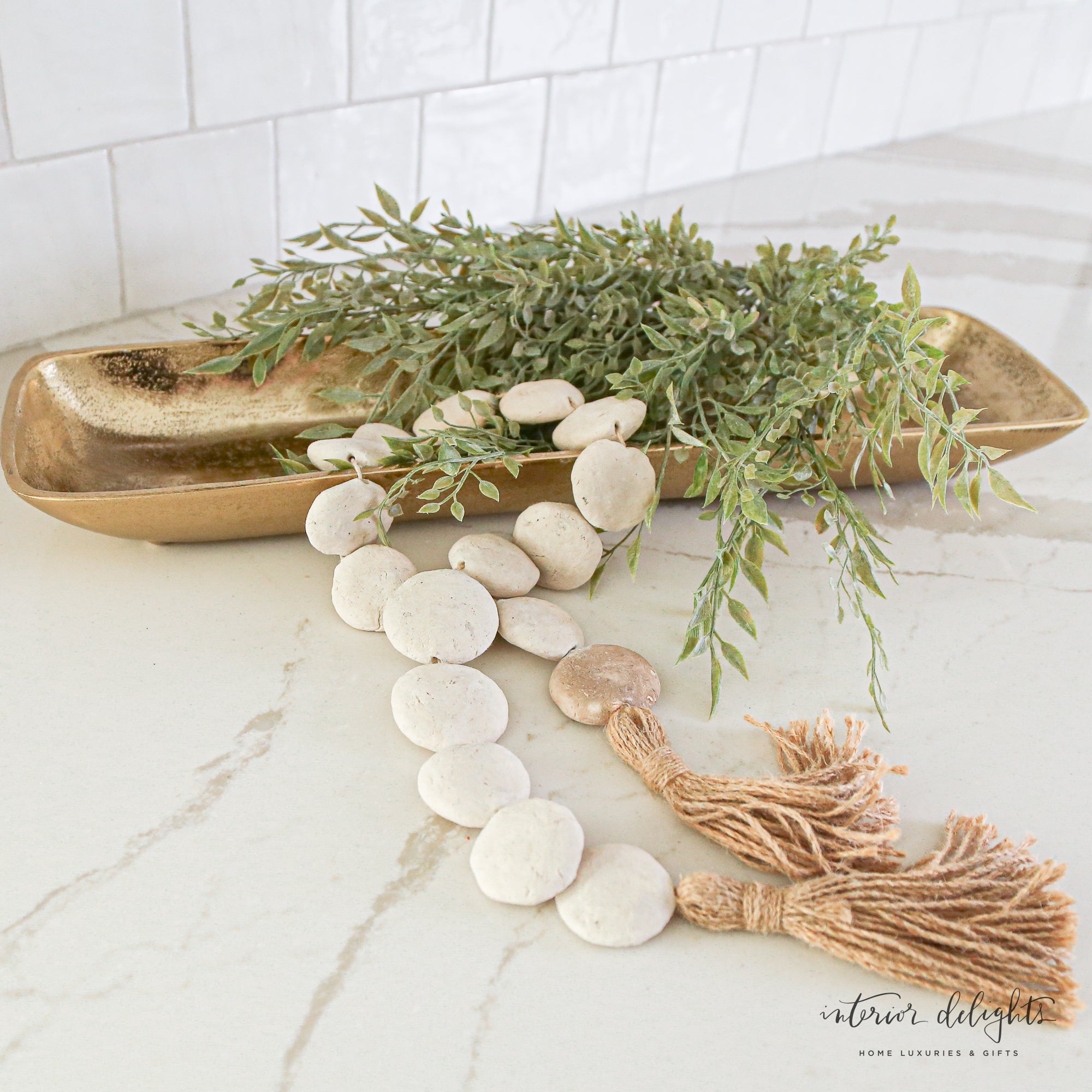Natural Textured Flat Bead Garland - 35in draped elegantly over a wooden tray, adding charm and texture to home decor.