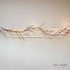 7ft LED-Twiggy Lit Garland, featuring warm lights and natural twig design, perfect for decorating mantels or banisters indoors or outdoors.