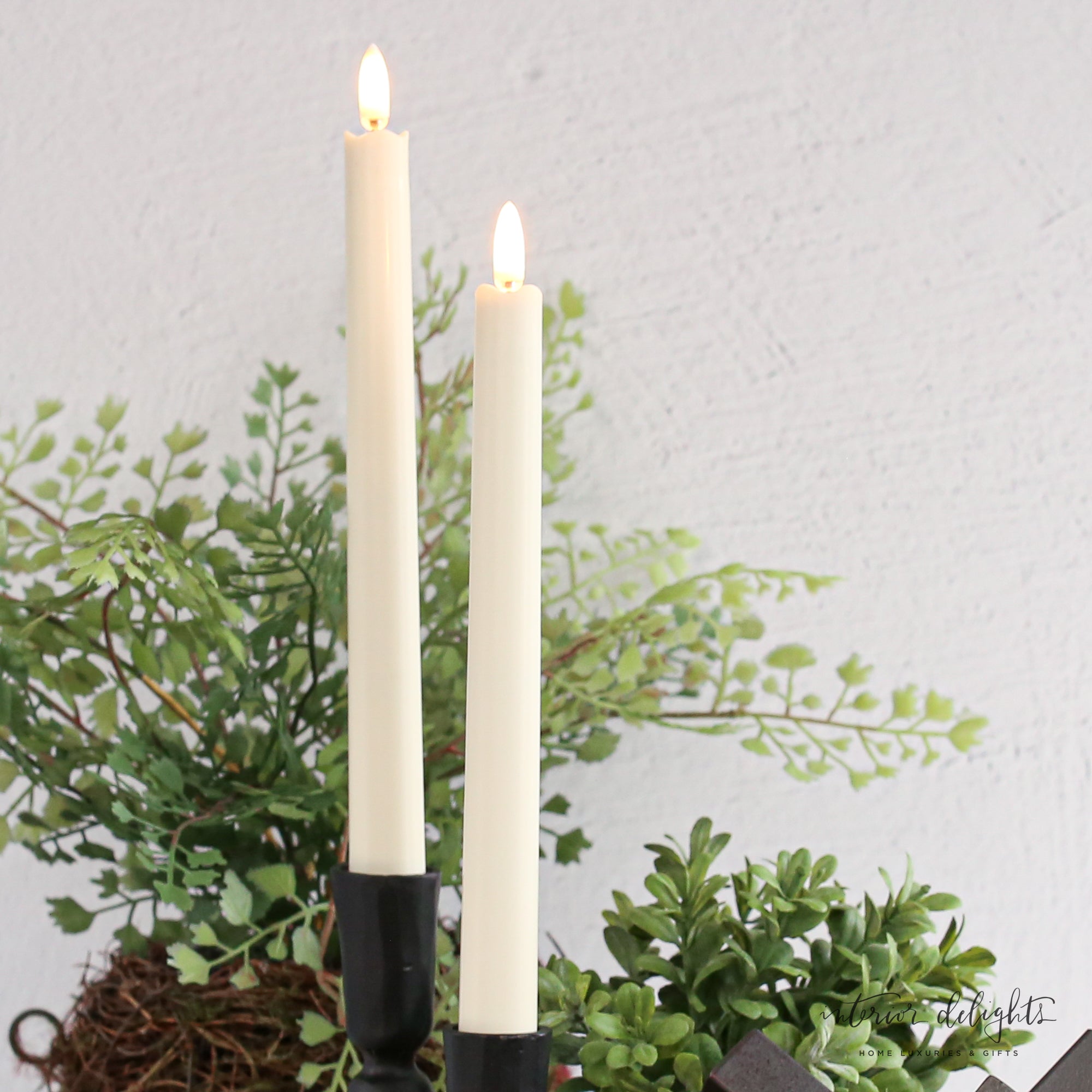 Flameless Taper Candles: Set of 2, realistic 10-inch tall plastic candles with a rubber base for stability in holders, ideal for cozy lighting without the mess of wax.