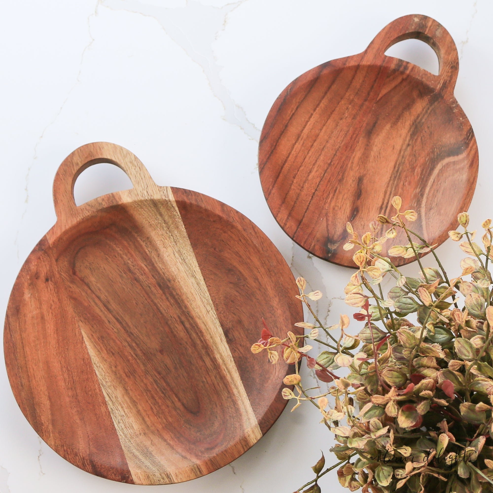 Round Wooden Trivet - Set of 2, showcasing small and large acacia wood trays with handles for stylish kitchen decor.