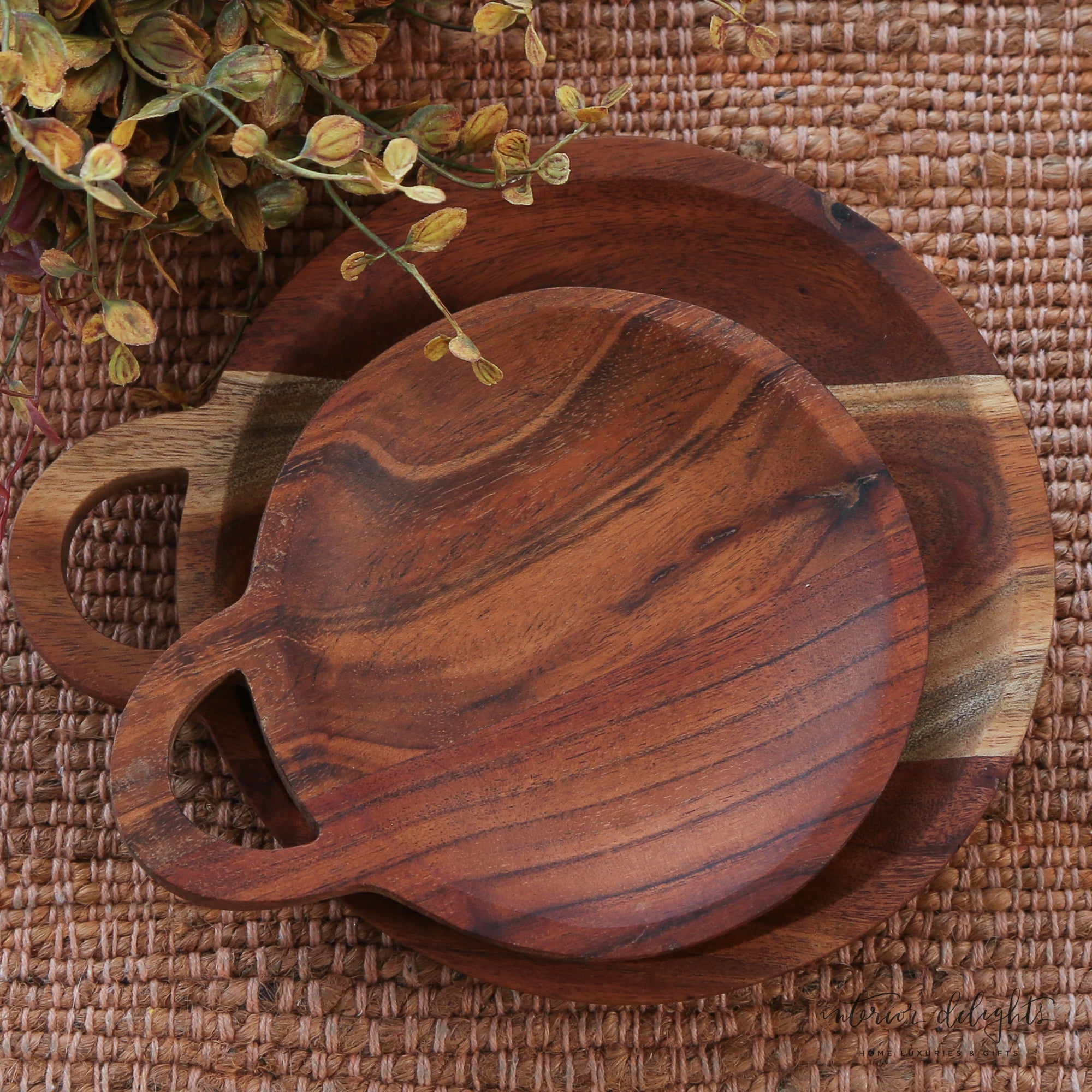 Detail of Round Wooden Trivet - Set of 2 showcasing the elegant handles and unique bowl shape.