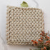Close-up of Pumpkin Knit Pot Holders showcasing thick knit texture for safe handling of hot pots and pans.
