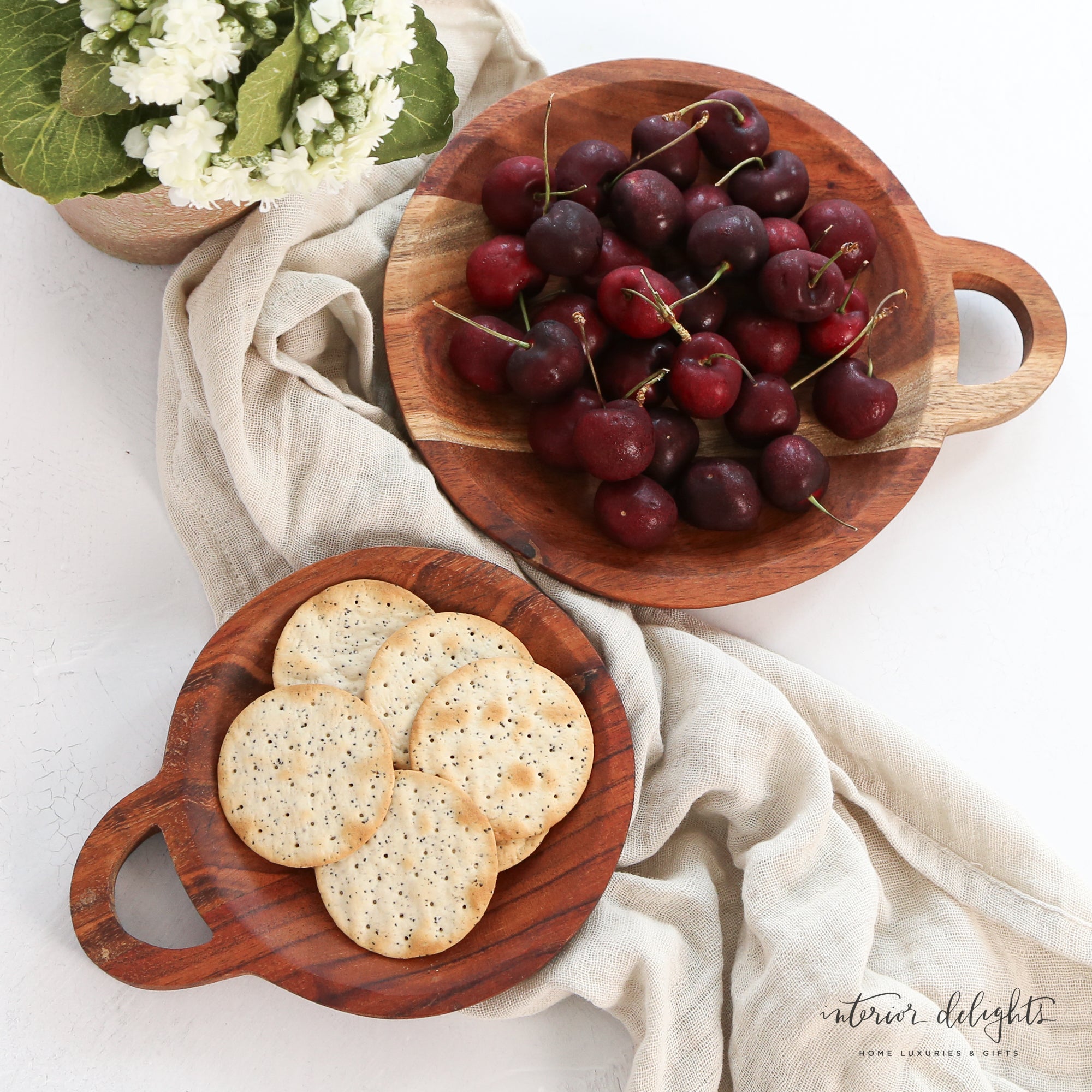 Round Wooden Trivet - Set of 2, featuring beautiful acacia wood design, perfect for serving food alongside charcuterie boards.