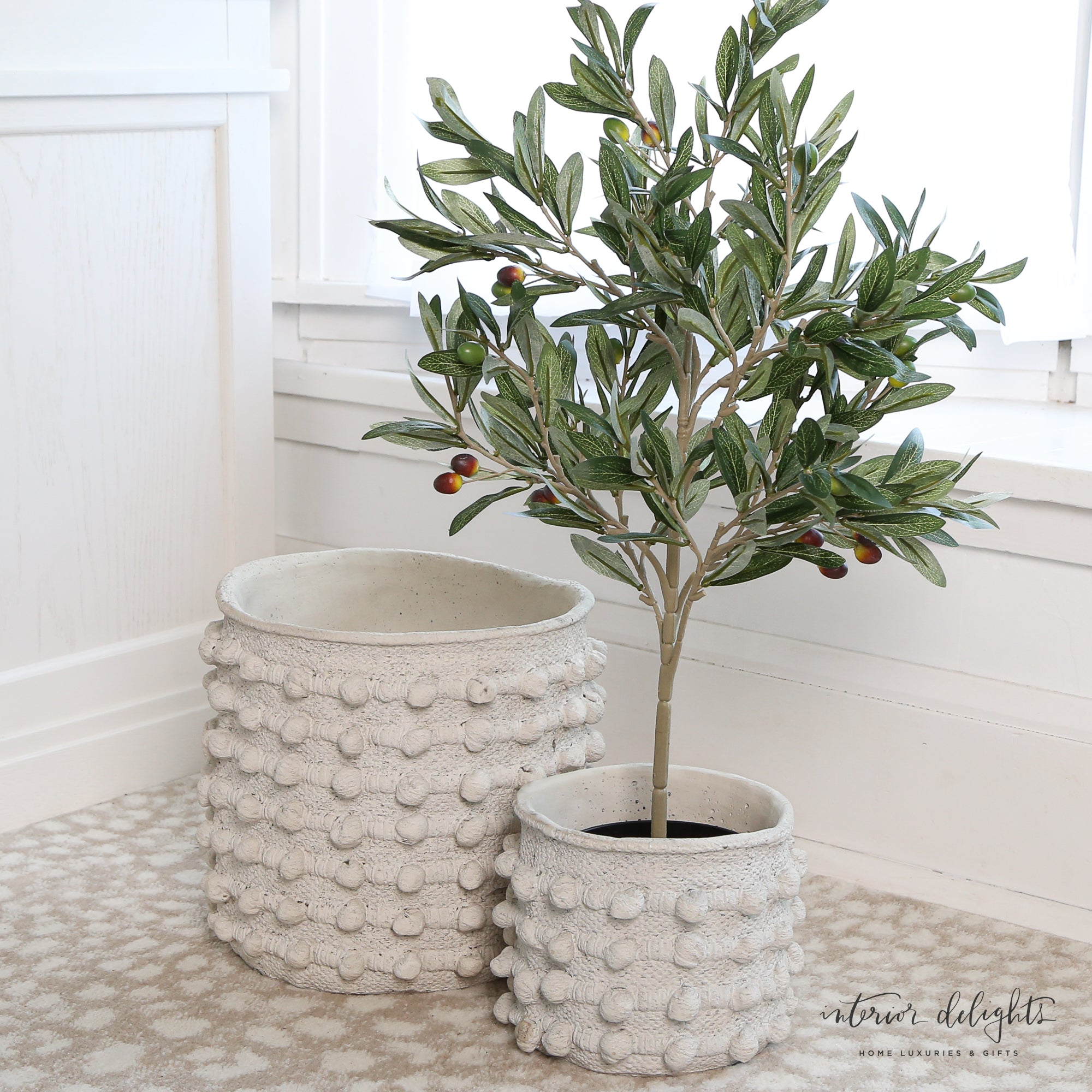 Both the 11” and 8” Cream Knot Planters set of 2, ideal for outdoor use with no drainage holes.