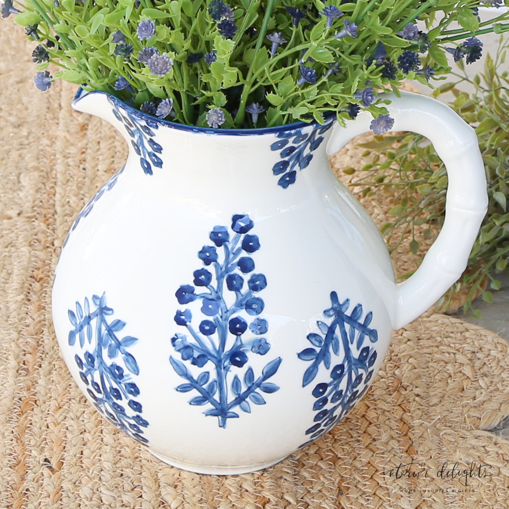 Lifestyle shot of the Block Print Pitcher filled with flowers, highlighting its decorative appeal.