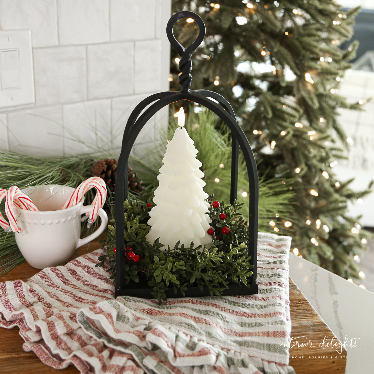 Twisted Top Lantern featuring a cozy black iron design perfect for countertops and shelves.