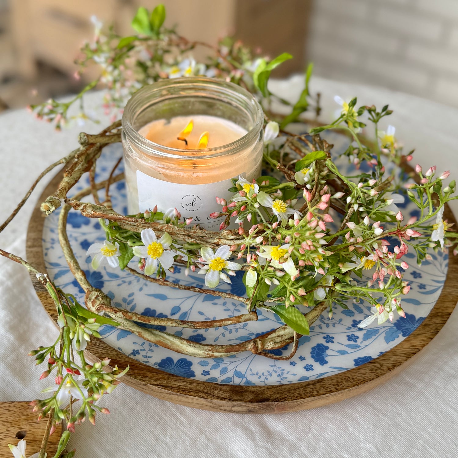 Decorative 5ft Mini flower Garland draped over a mantel, showcasing its bendable design and romantic aesthetic.
