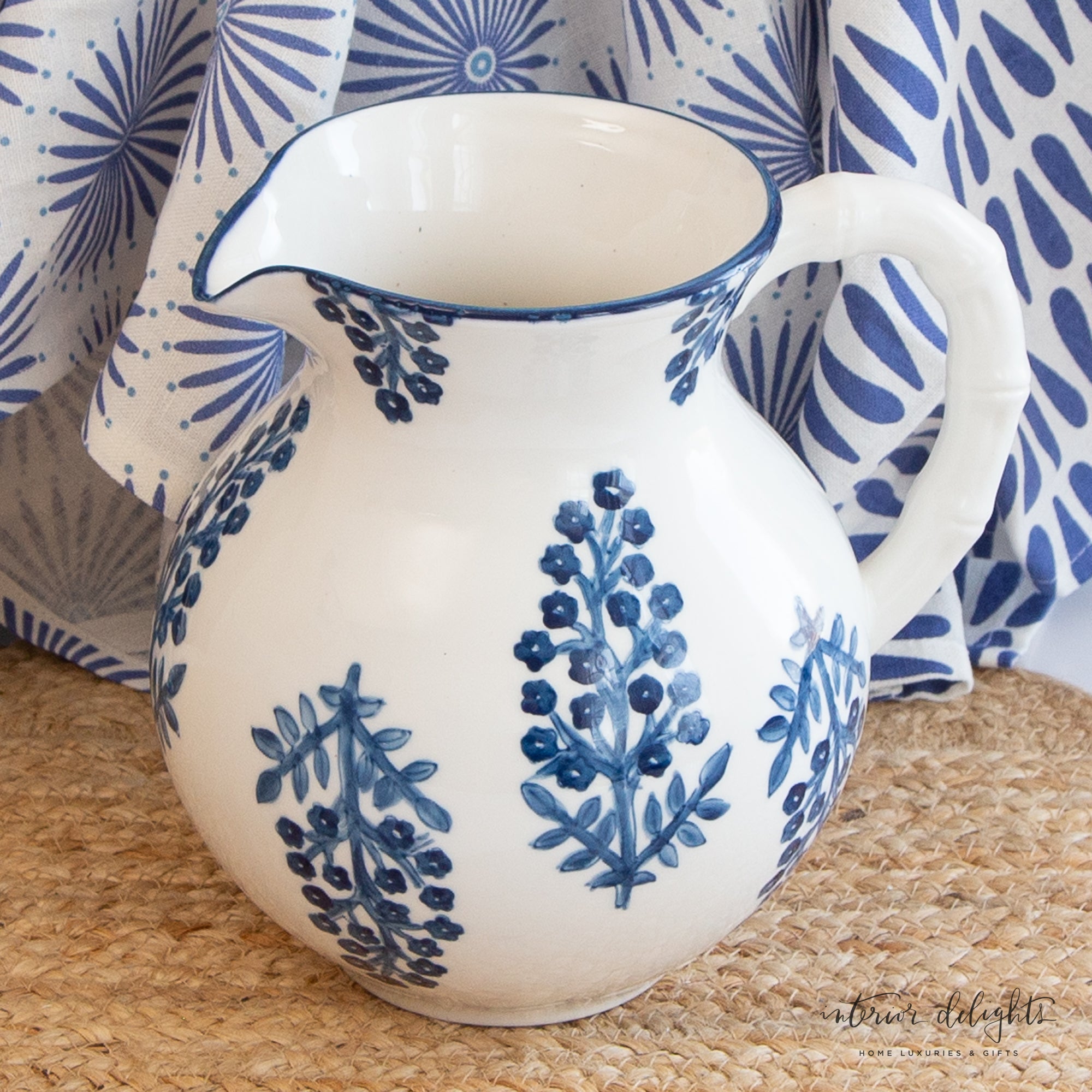 Block Print Pitcher showcasing charming blue flowers with a bamboo shaped white handle.