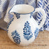 Block Print Pitcher showcasing charming blue flowers with a bamboo shaped white handle.