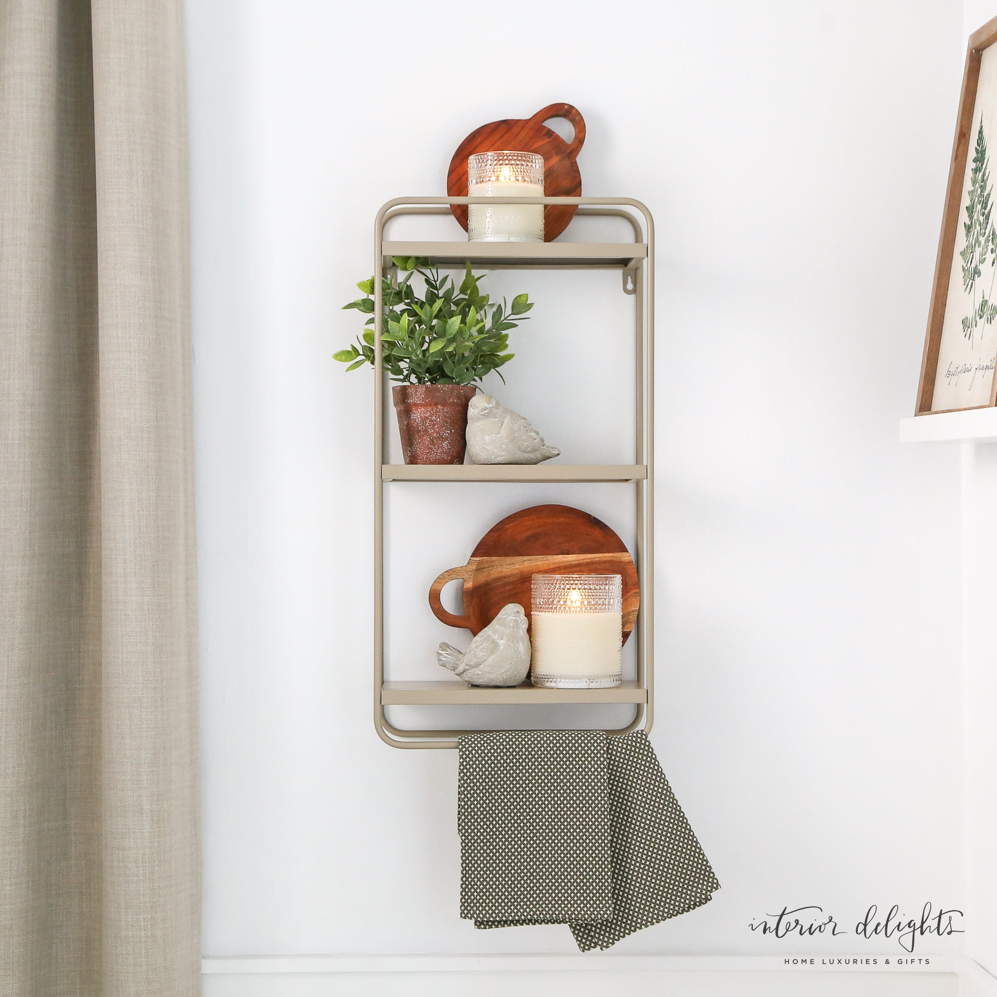 Metal Wall Shelf with three individual shelves in neutral beige, ideal for decor display in bathrooms or small spaces.