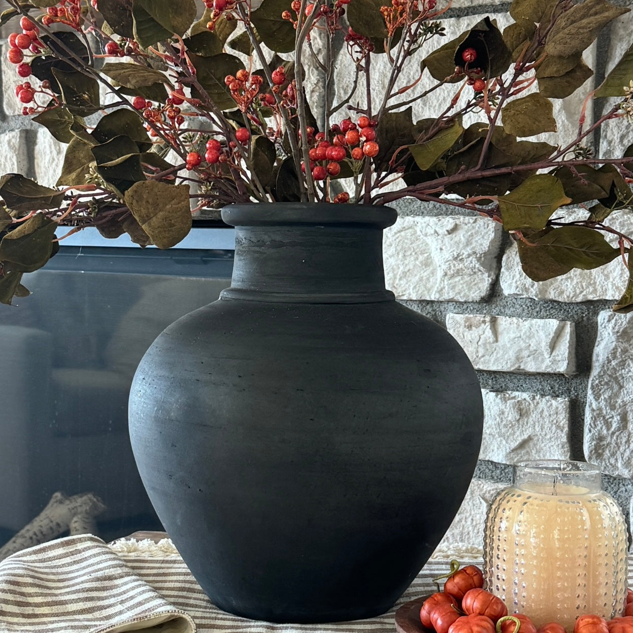 13.5 in Black Terracotta Vase featured with Norfolk Pine Sprays for a chic winter decor.