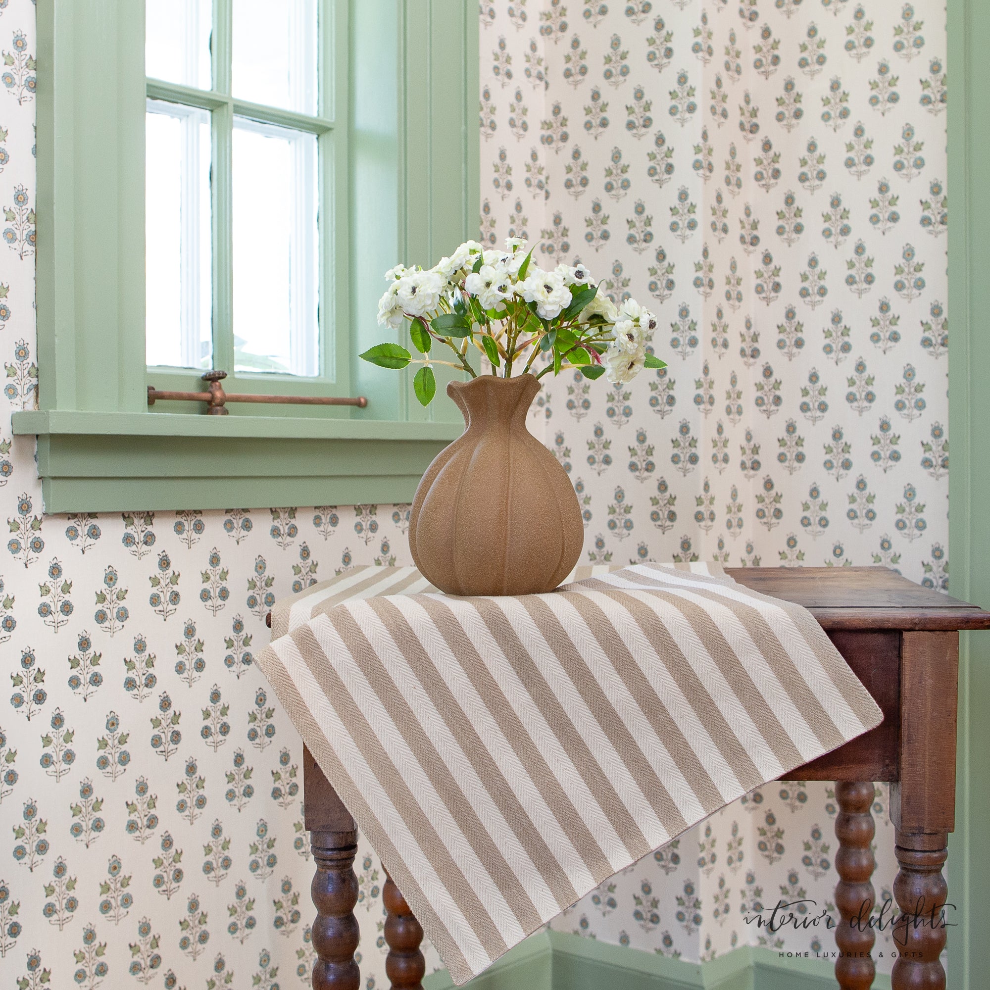 7” Brown Stoneware Vase styled with bright florals, enhancing its rustic yet elegant design.