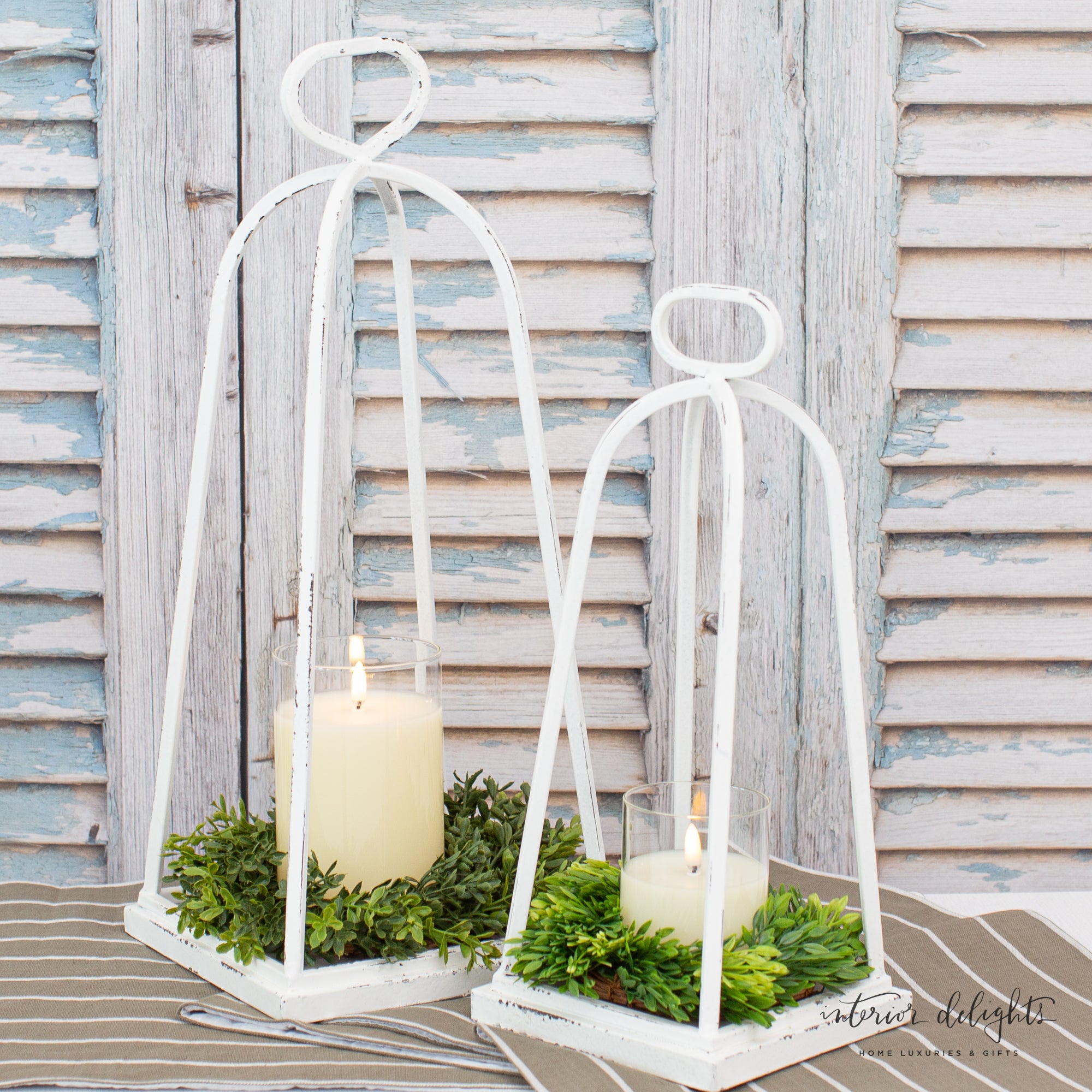 Detailed view of the New England Boxwood Candle Ring, showcasing its realistic boxwood leaves and ideal fit for lanterns and decorative settings.