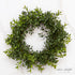 10-inch New England Boxwood Candle Ring exhibiting dense and lifelike greenery, perfect for enhancing candle displays or seasonal decor.