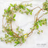 5ft Mini flower Garland featuring pinkish buds and white flowers with yellow centers on a green vine.