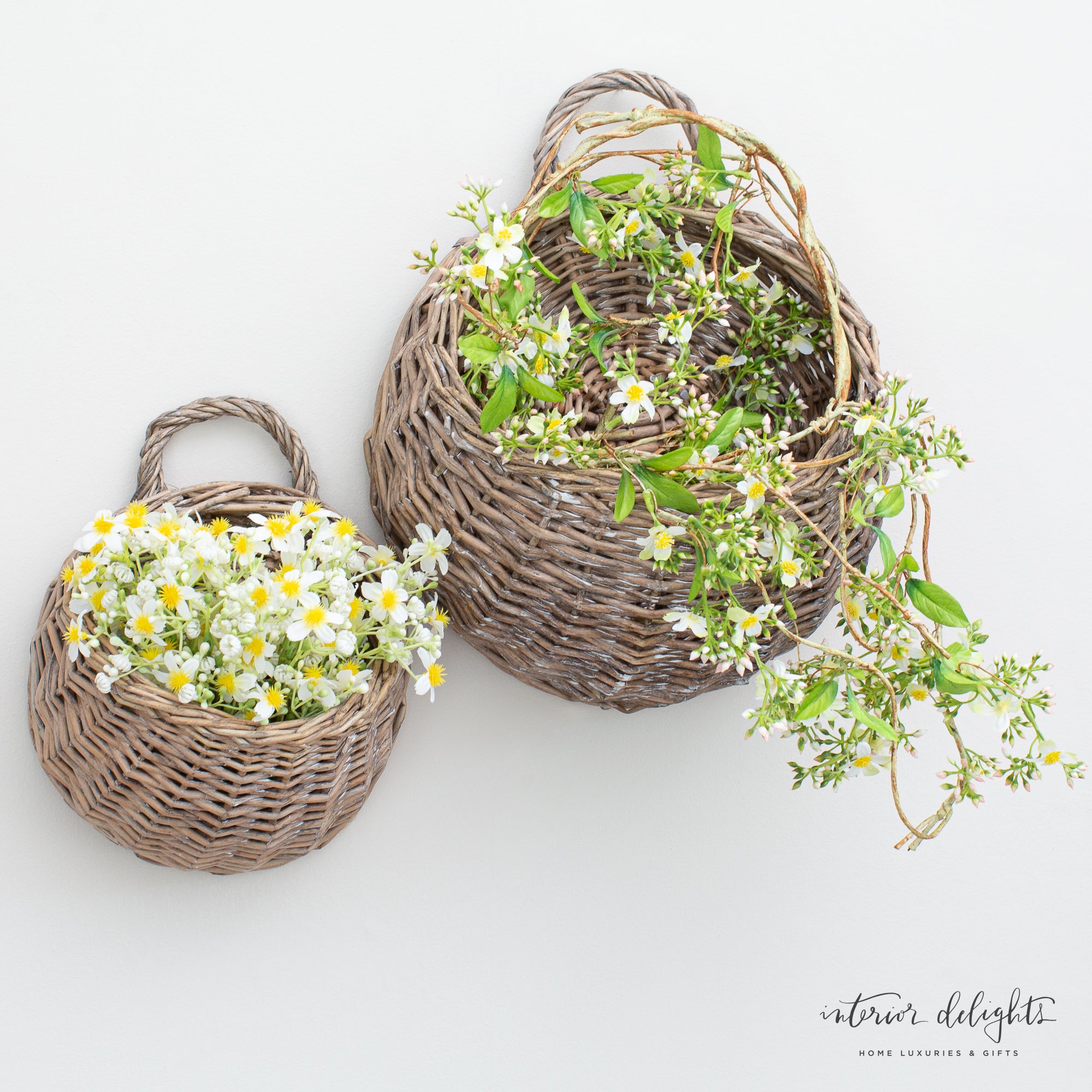 Close-up of the 5ft Mini flower Garland showcasing delicate white flowers and lush green leaves.