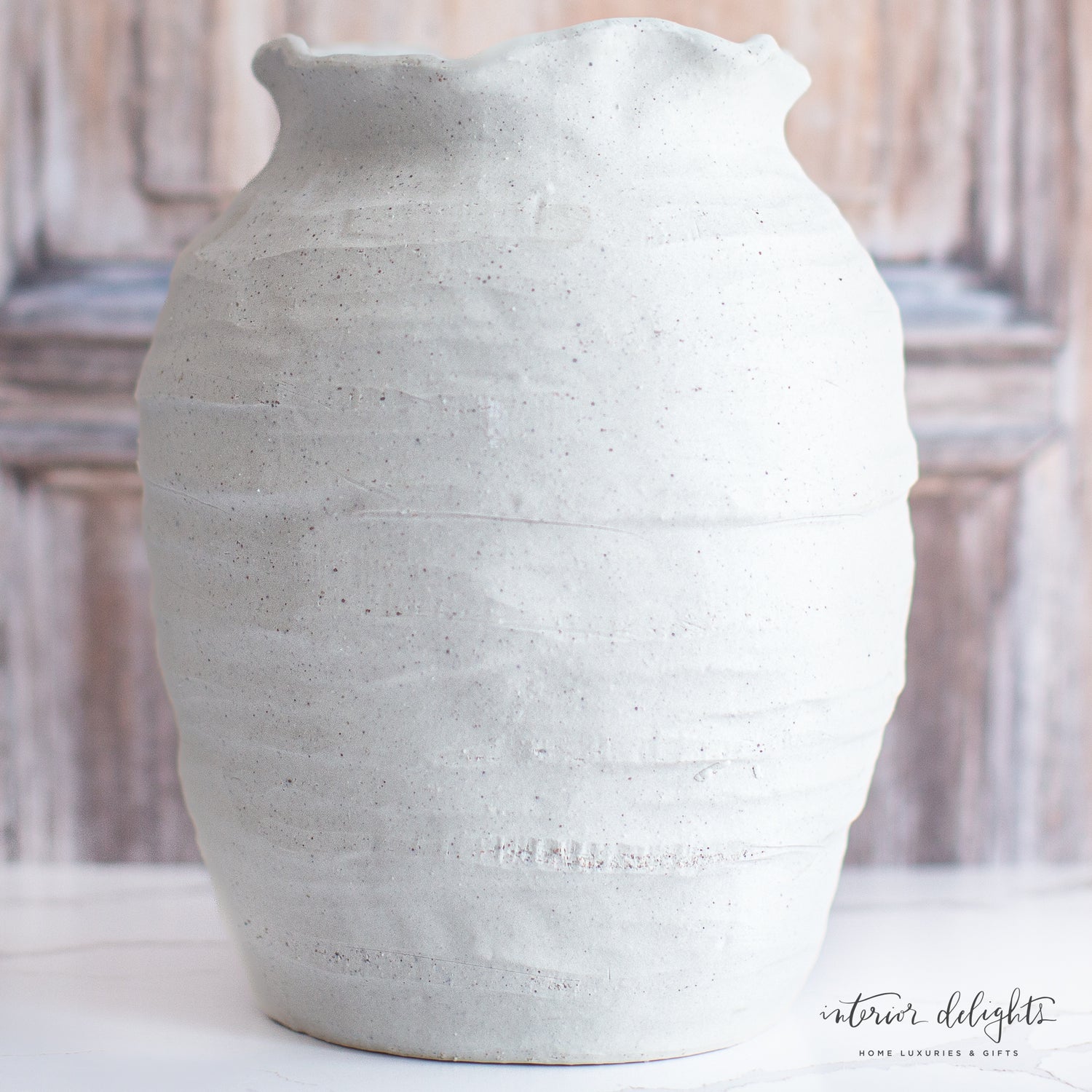 12” Ivory Scalloped Top Stoneware Vase styled with seasonal stems for a charming decor display