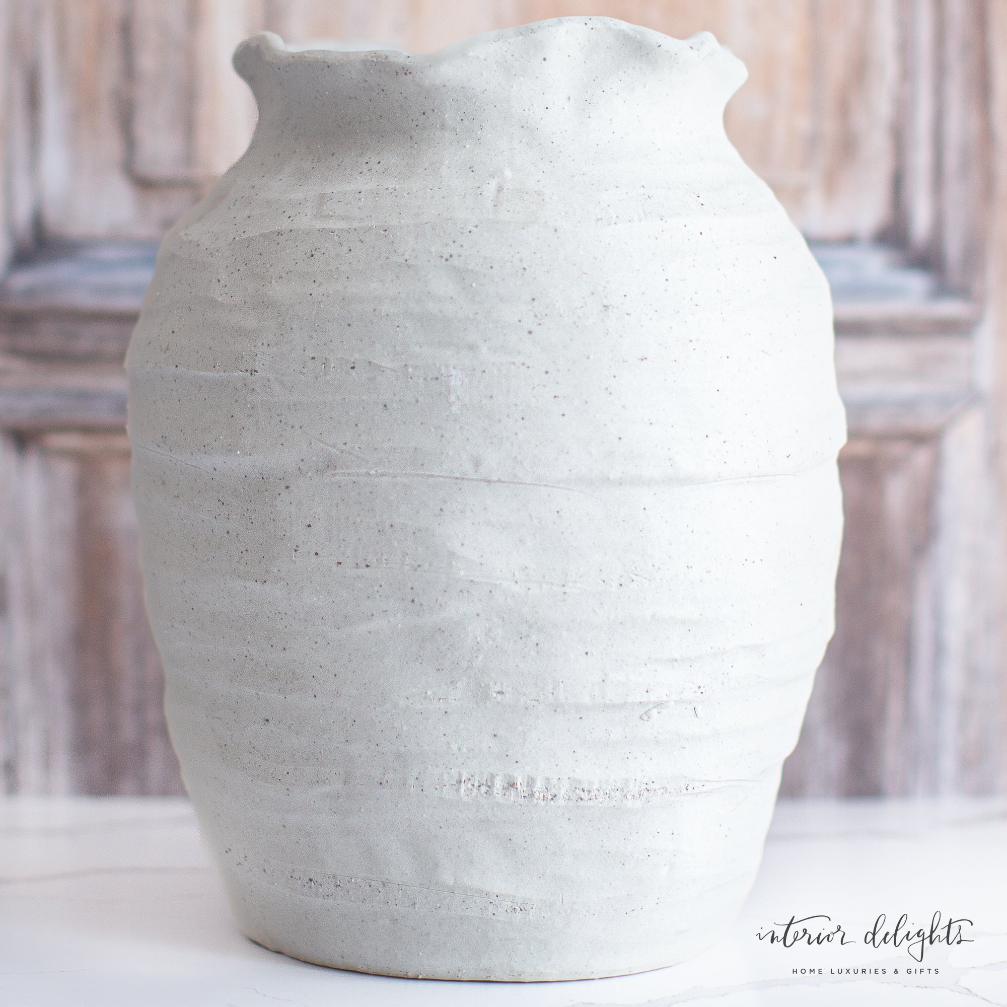 12” Ivory Scalloped Top Stoneware Vase styled with seasonal stems for a charming decor display