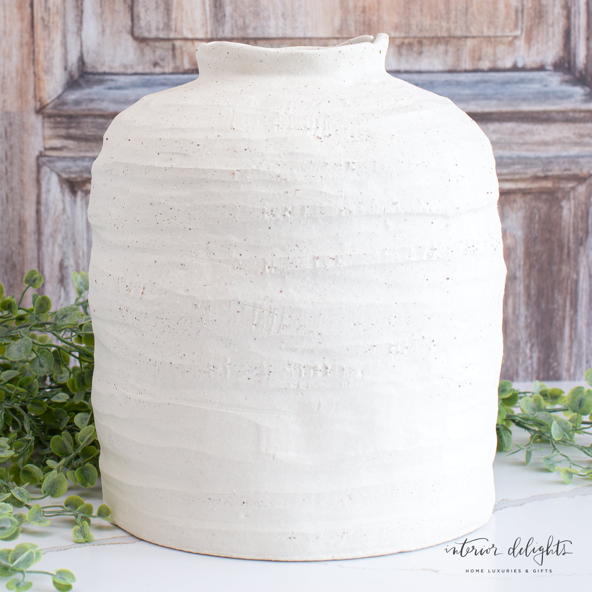 Close-up view of the 10.5” Ivory Stoneware Vase emphasizing the subtle ivory color that complements any interior.