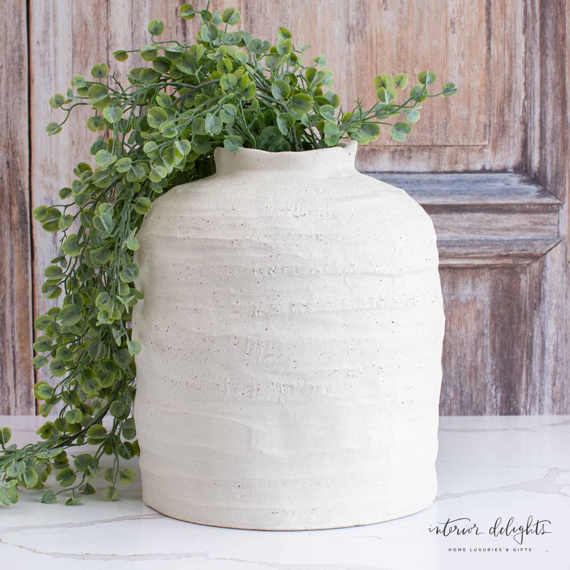 10.5” Ivory Stoneware Vase showcasing its organic shape and textured finish, perfect for cottage-inspired decor.