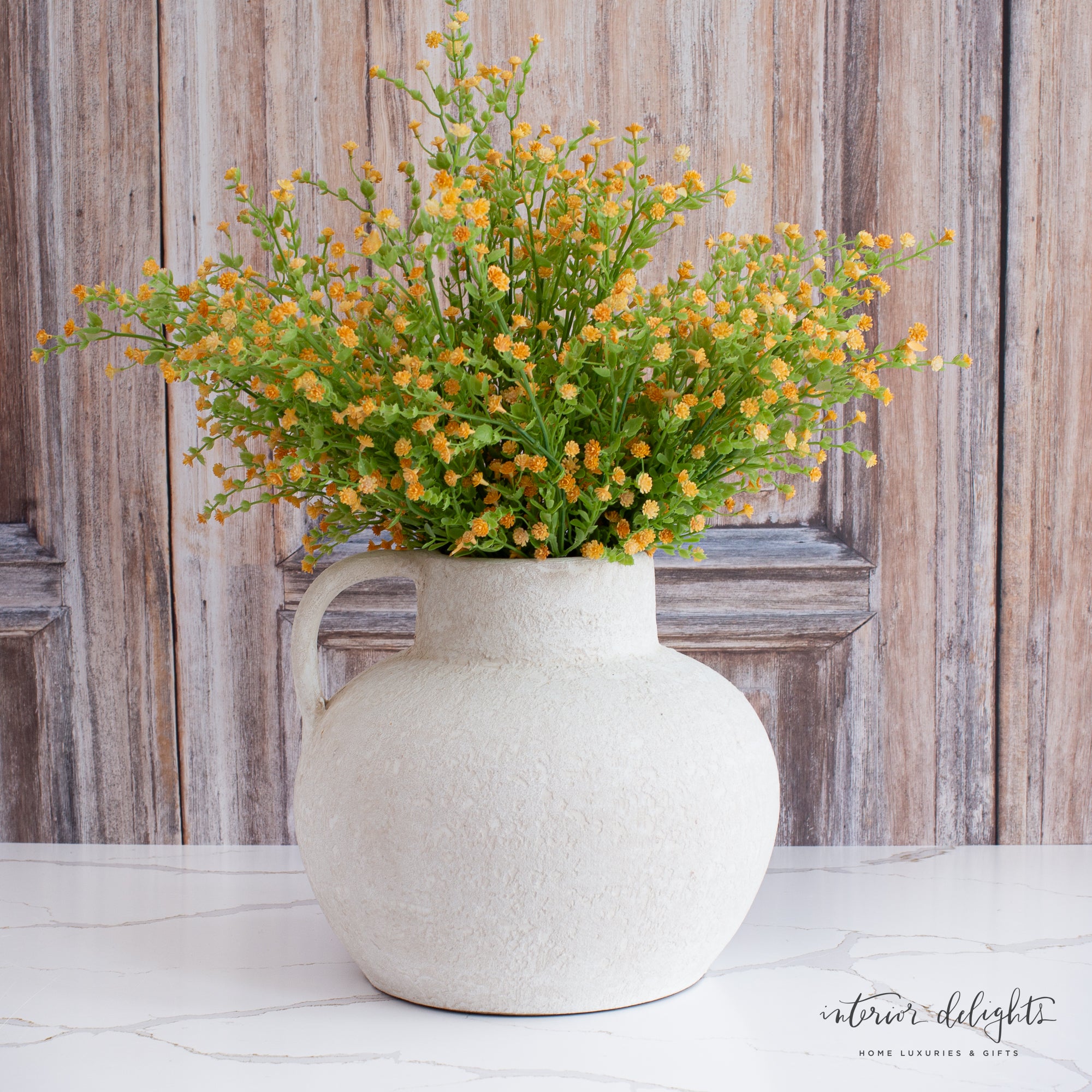 10” Luxe Heavy Textured White Handle Vase on a wooden table, adding rustic elegance to the setting.