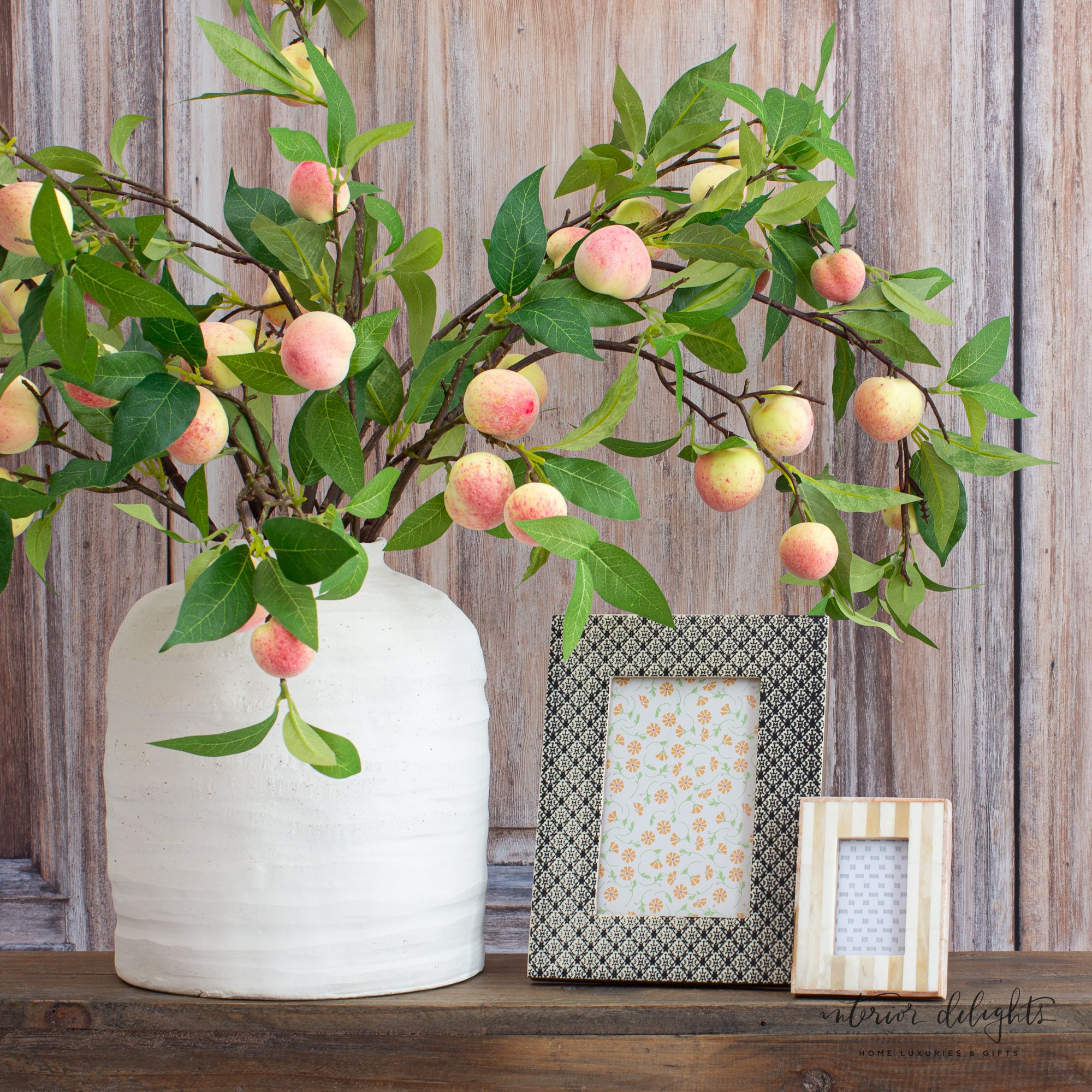 The 10.5” Ivory Stoneware Vase from a side angle, highlighting its organic shape and soft texture, perfect for any decor.