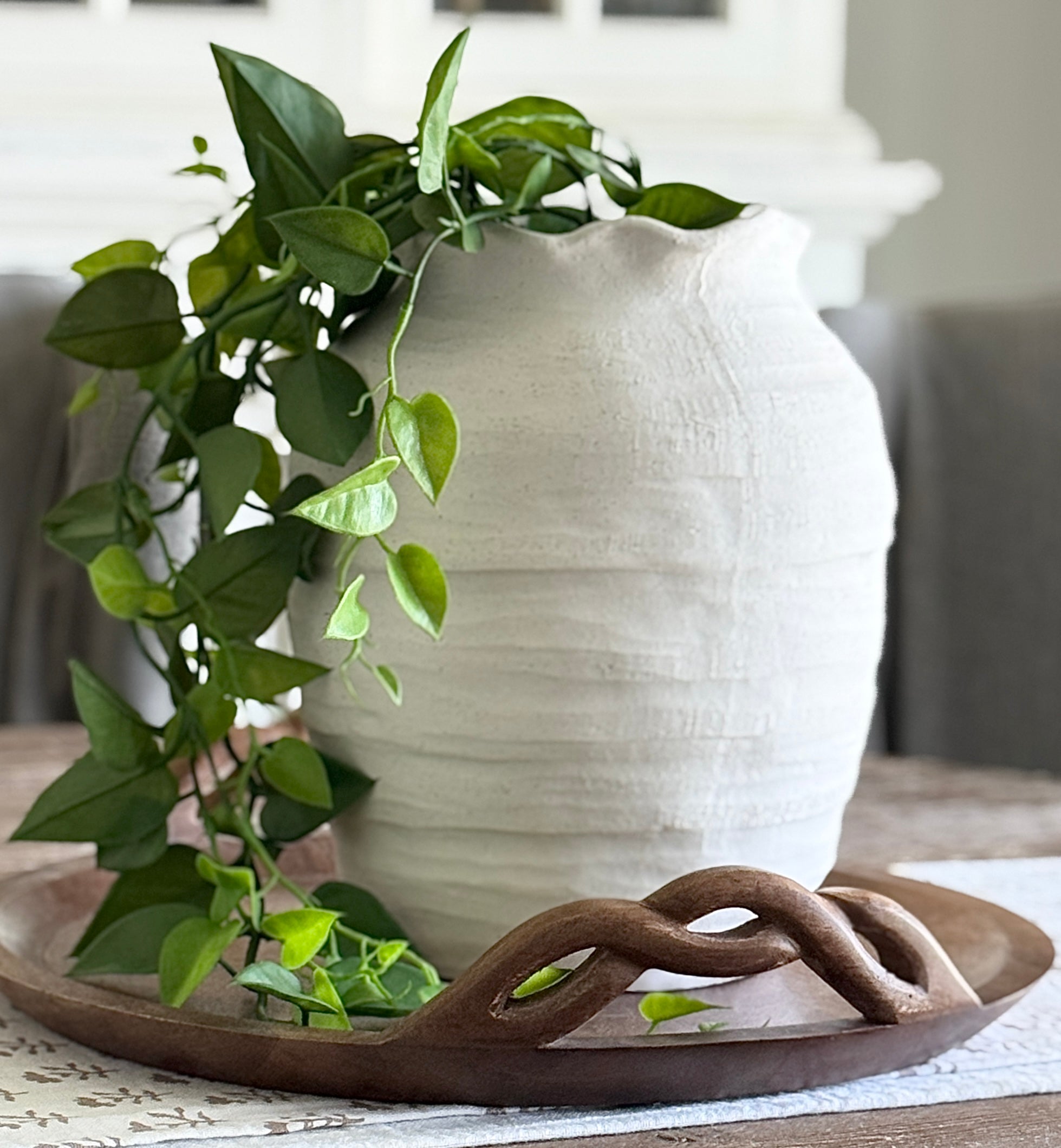 Beautiful 12” Ivory Scalloped Top Stoneware Vase showcasing its charming ruffled rim and elegant organic shape, perfect for displaying flowers or as a decorative piece.
