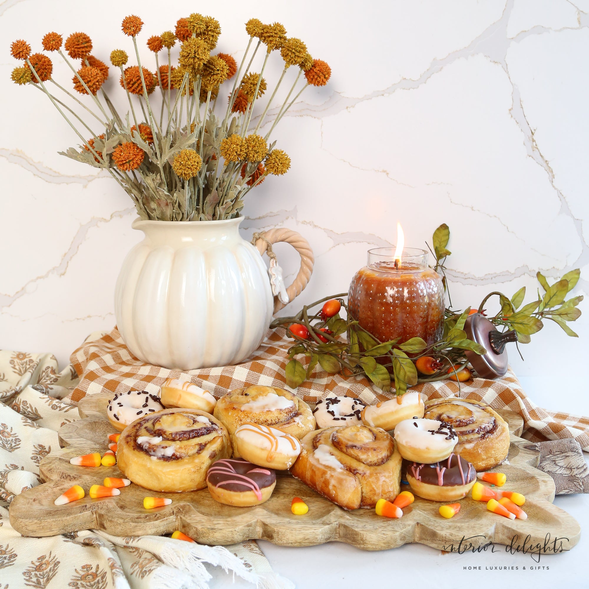 Charming white pumpkin pitcher, microwave and dishwasher safe, enhances festive autumn table settings.