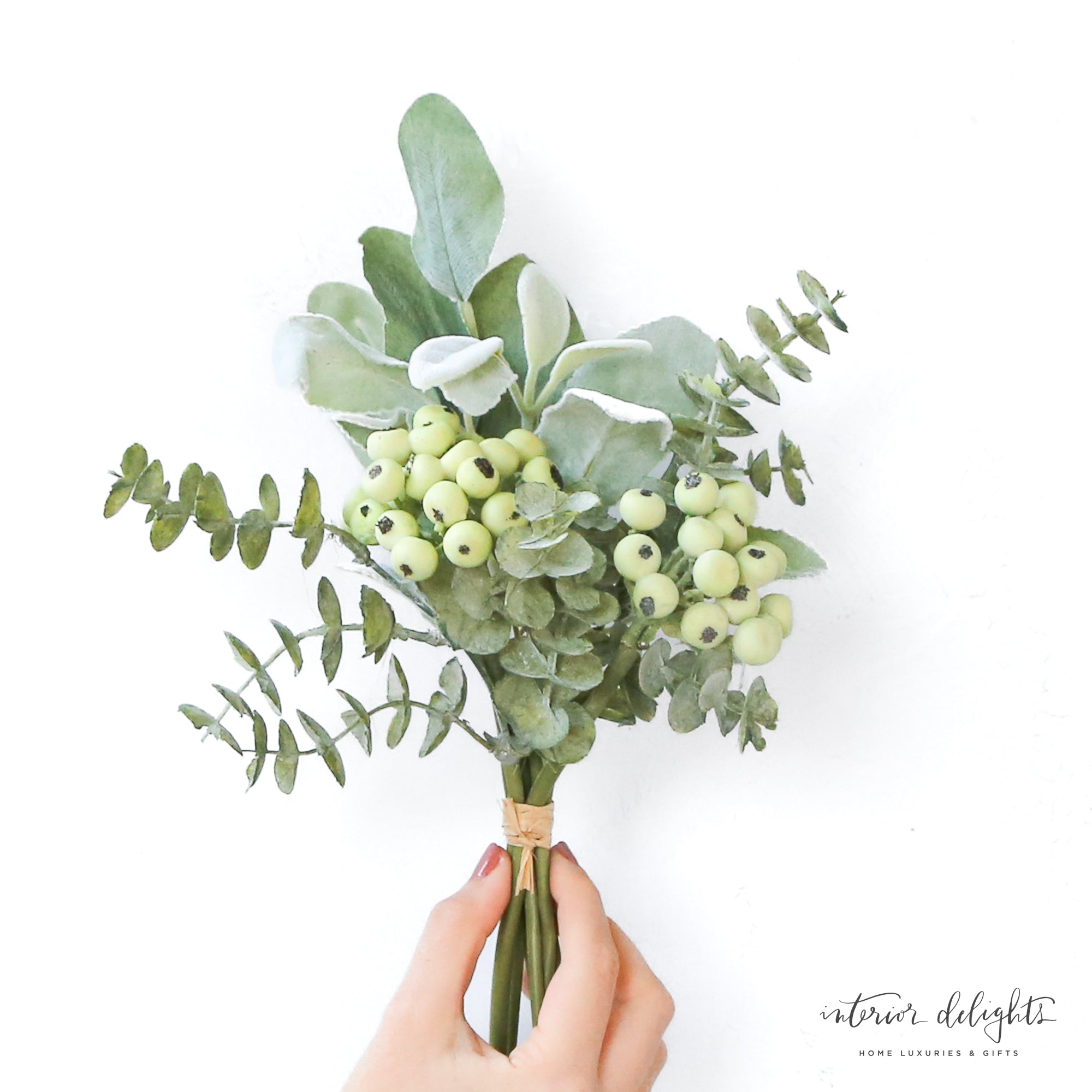 A close-up view of the Mixed Green Foliage with Berries Bundle, highlighting the lush green leaves and colorful berries, perfect for creating beautiful floral arrangements.