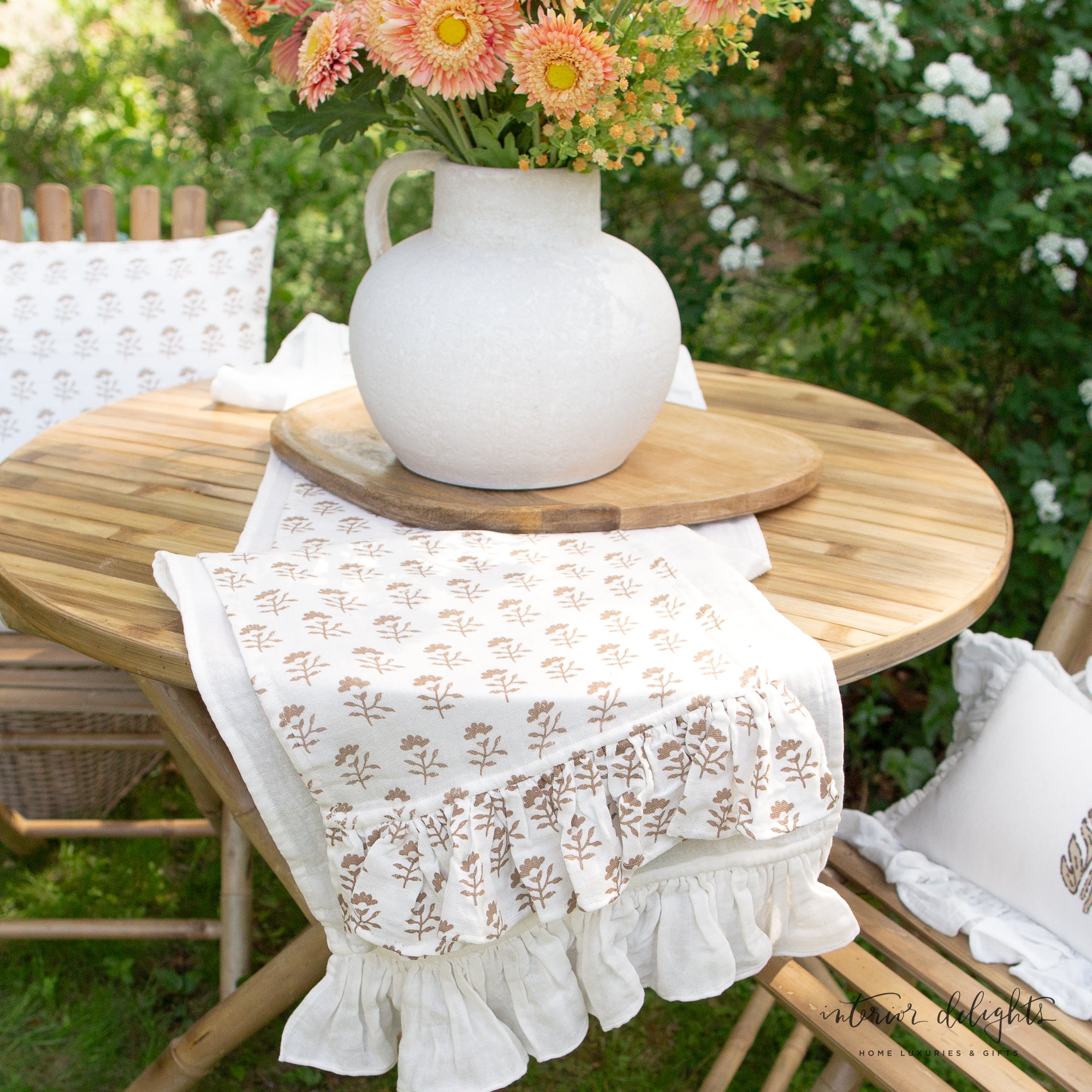 Light brown block-printed floral table runner from the Bundle of Two Molly Table Runners, showcasing a soft feminine design and ruffled ends.