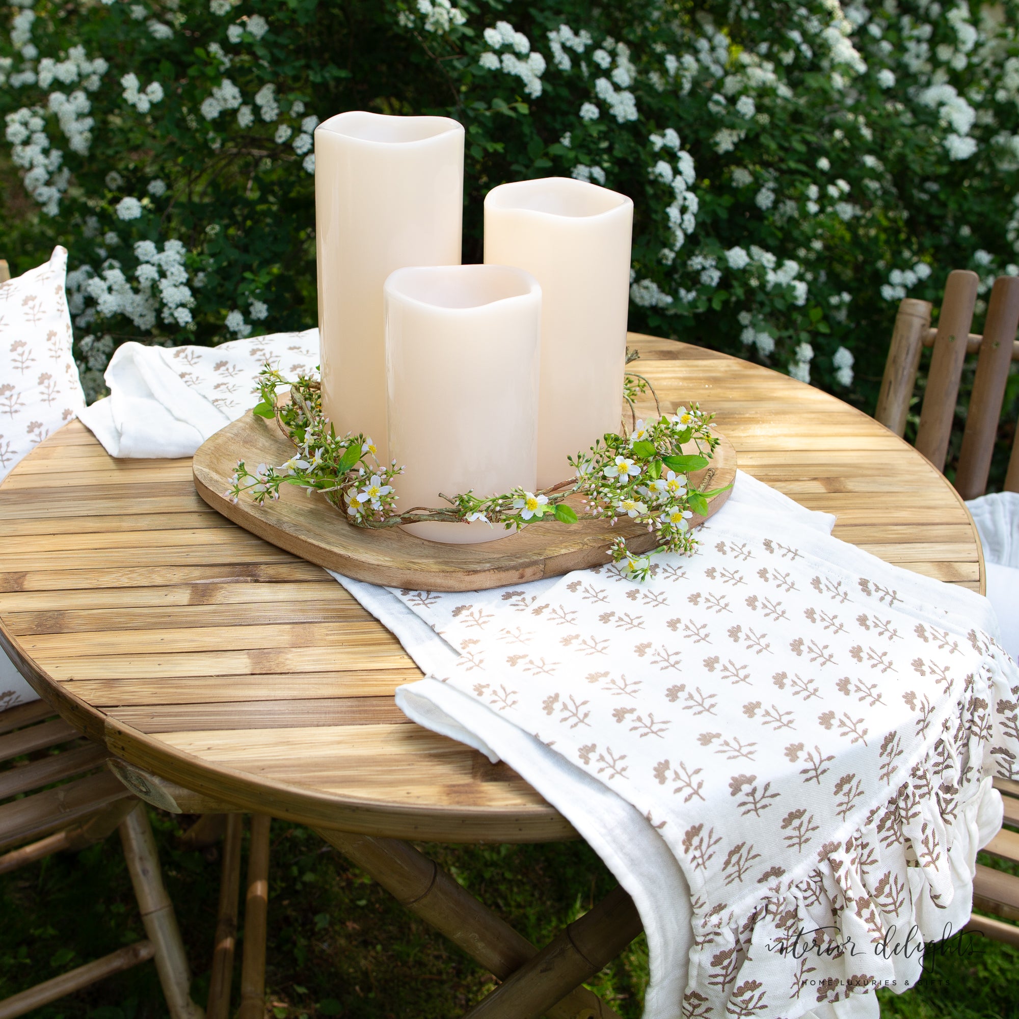Set of 3 Outdoor LED Candles casting a warm white glow, perfect for creating a cozy ambiance.